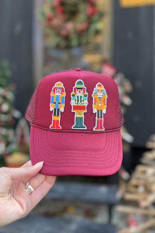 Patchy Nutcracker Trucker Hat in Burgundy